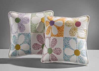 Bedsprei en kussenslopen in patchworkstijl 