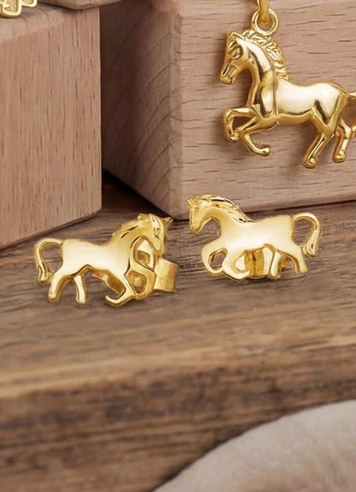 Paardenoorbellen van goud 