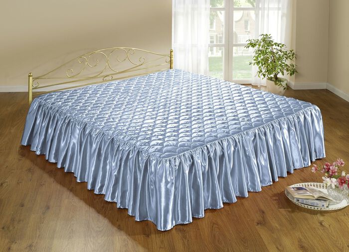 Elegante, glanzende sprei en kussenslopen met quilting in schelplook 