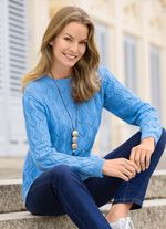 Trui met een langer wordend golfontwerp 