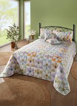 Bedsprei en kussenslopen in patchworkstijl 