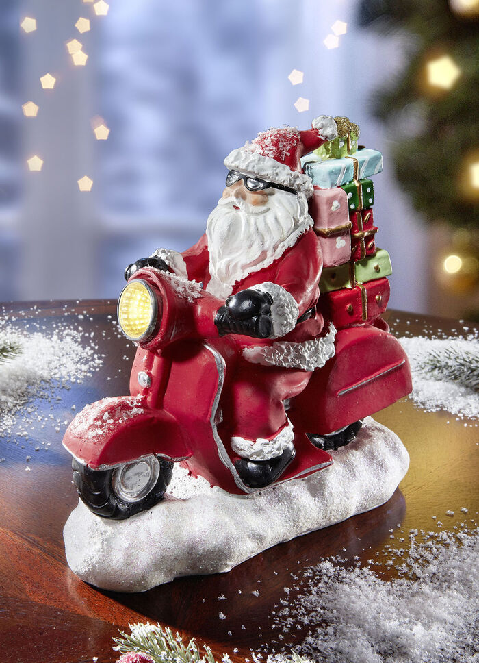 Verlichte Kerstman op een scooter 