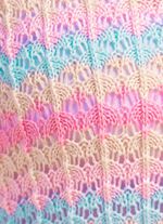 Trui met opengewerkt patroon in strependessin 