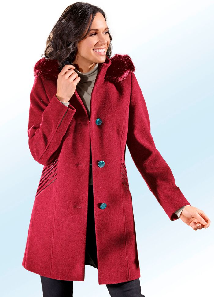 Lange jas in 2 kleuren met contrasterende decoratieve stiksels op de zijzakken 