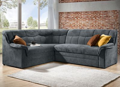 Gestoffeerde hoekbank met slaapfunctie die vrij in de ruimte geplaatst kan worden 