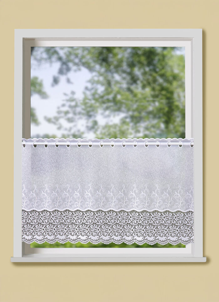 Klein raamgordijn met gebogen macramé-afwerking 
