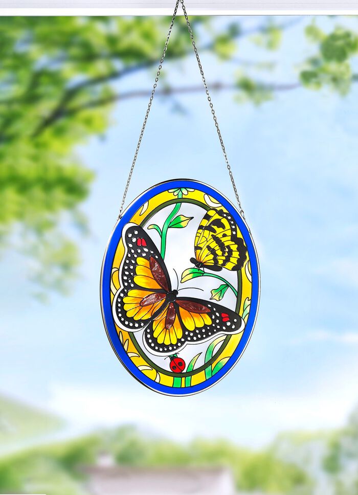 Glasplaat met metalen frame en metalen ketting 