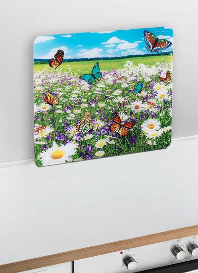 Wandpaneel van glas met zomerweidemotief 