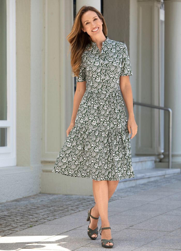 Jurk met een doorlopende decoratieve knoopsluiting 