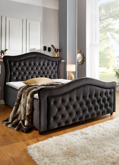 Boxspringbed met gevoerd hoofd- en voeteneind 