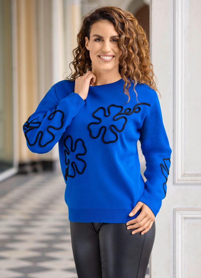 Trui met bloemapplicaties 