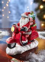 Verlichte Kerstman op een scooter 
