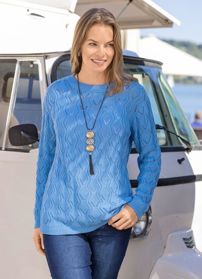 Trui met een langer wordend golfontwerp 