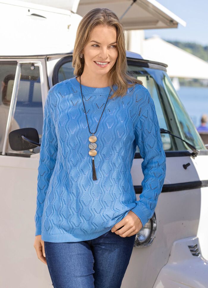 Trui met een langer wordend golfontwerp 