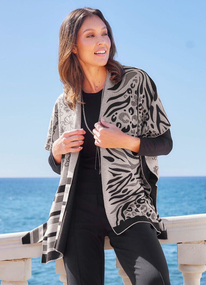 Poncho met elegant jacquarddesign 